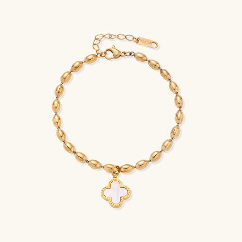 18K gold-plated oval bead bracelet with a four-leaf clover charm in mother-of-pearl or black enamel, adjustable lobster clasp, on white background.