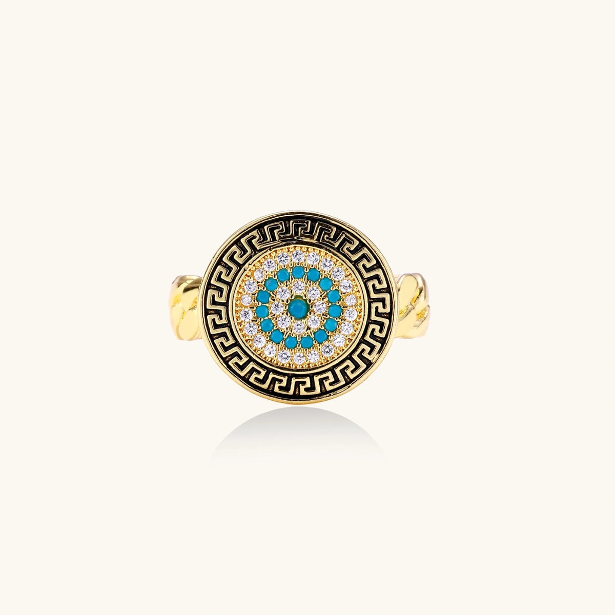 Gold chain ring with Greek key border and turquoise evil eye center on white background
